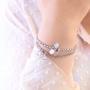 Ohrringe und Armb&auml;nder mit Anh&auml;ngern aus Kristallglas