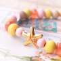 Schmuck mit einem Strandthema aus Holzperlen, DQ Metall und Muscheln
