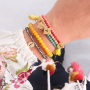 Schnelle Facett Armb&auml;nder mit Anh&auml;ngern und Quasten