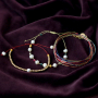 Mit Macram&eacute; Band, S&uuml;&szlig;wasserperlen und DQ Metall fertigen Sie diese Armb&auml;nder!