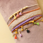 Mit Mini-Quasten verspielten Schmuck designen